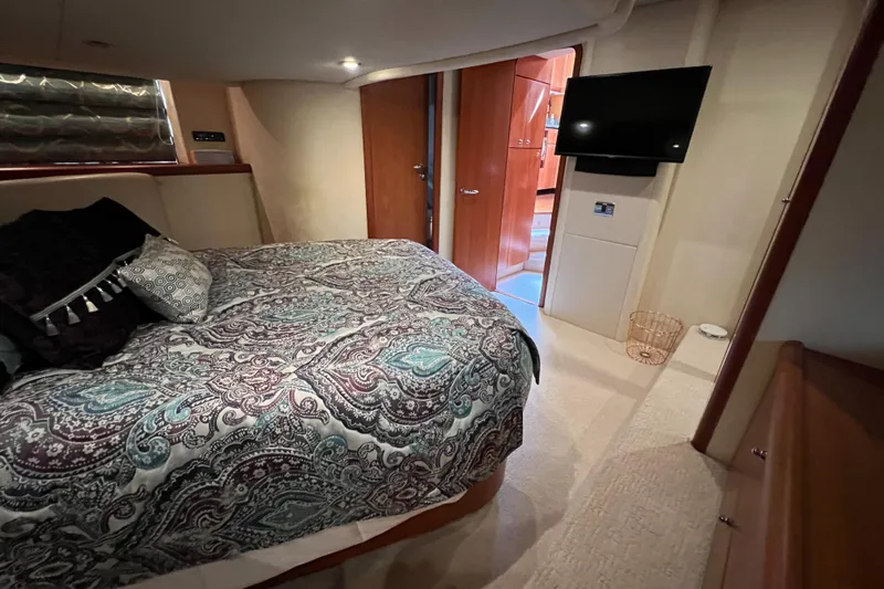 Slide: The Image of Luxurious bedroom interior of 2008 Sunseeker Manhattan 50 yacht with elegant bedding and TV. - 47