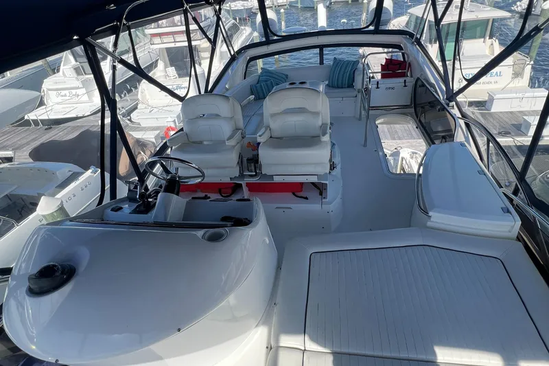 Slide: The Image of 2008 Sunseeker Manhattan 50 yacht interior with helm, seating, and marina view. - 8