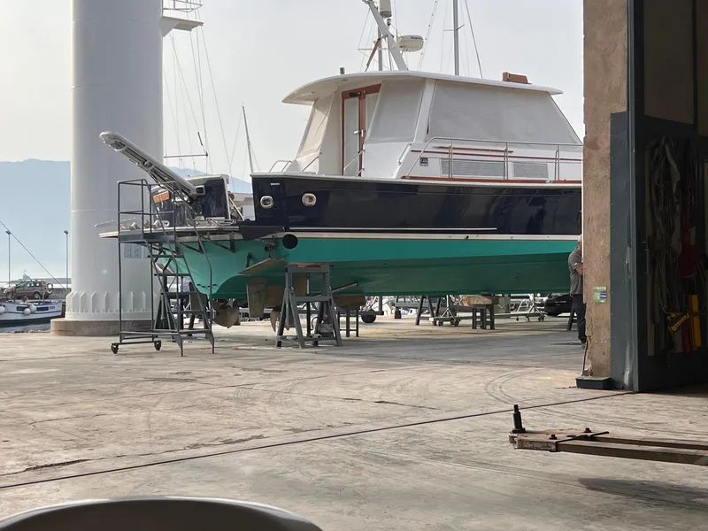 Slide: The Image of Grand Banks Eastbay 54 SX 2004 yacht in dry dock for maintenance. - 46