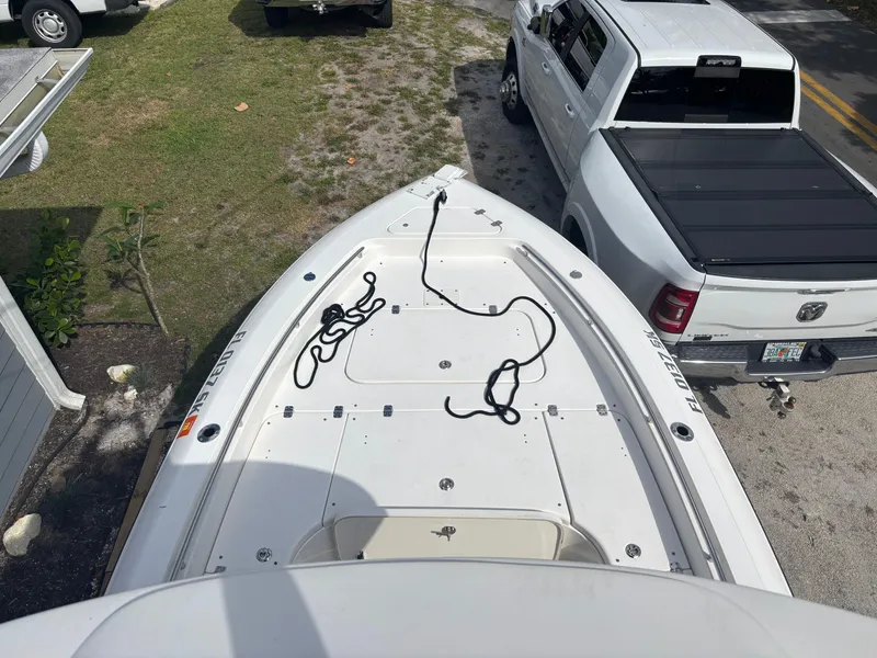 Slide: The Image of Overhead view of a 2016 ShearWater 260 Carolina Bay boat parked beside a white truck. - 17