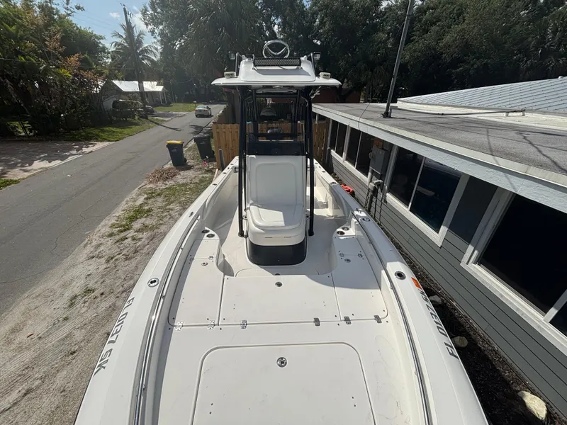 Slide: The Image of 2016 ShearWater 260 Carolina Bay boat docked beside a house on a sunny day. - 21