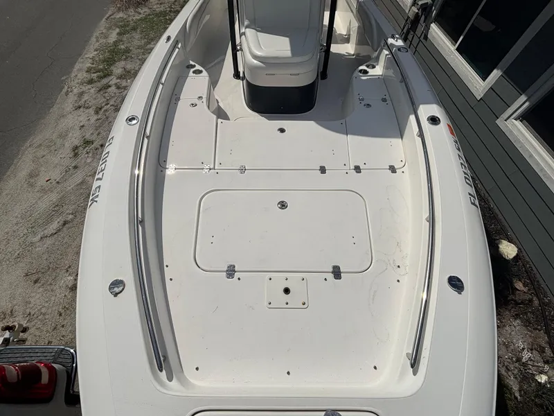 Slide: The Image of 2016 ShearWater 260 Carolina Bay boat deck, white, spacious layout, viewed from above. - 23