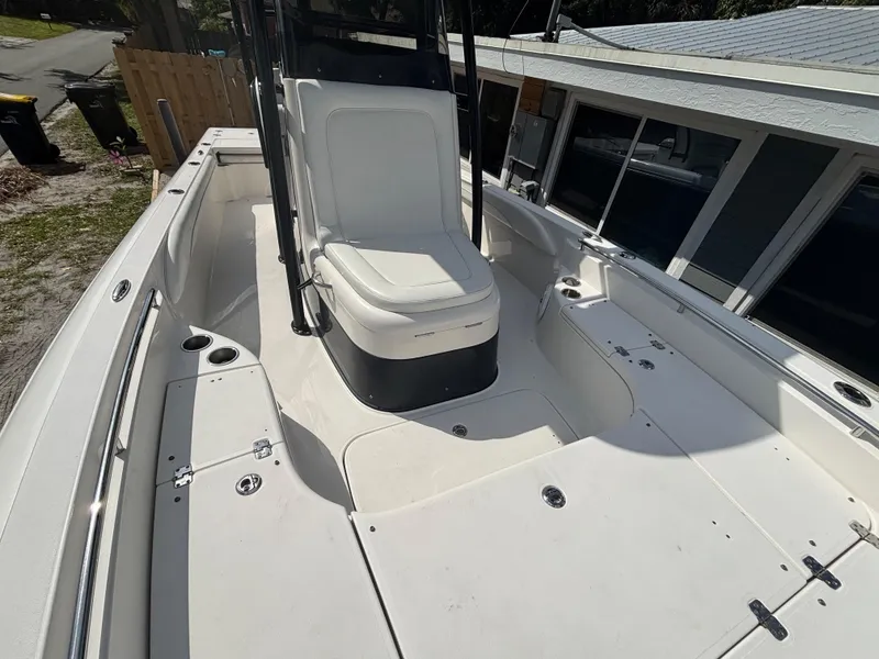 Slide: The Image of 2016 ShearWater 260 Carolina Bay boat interior with white seating and spacious deck. - 24