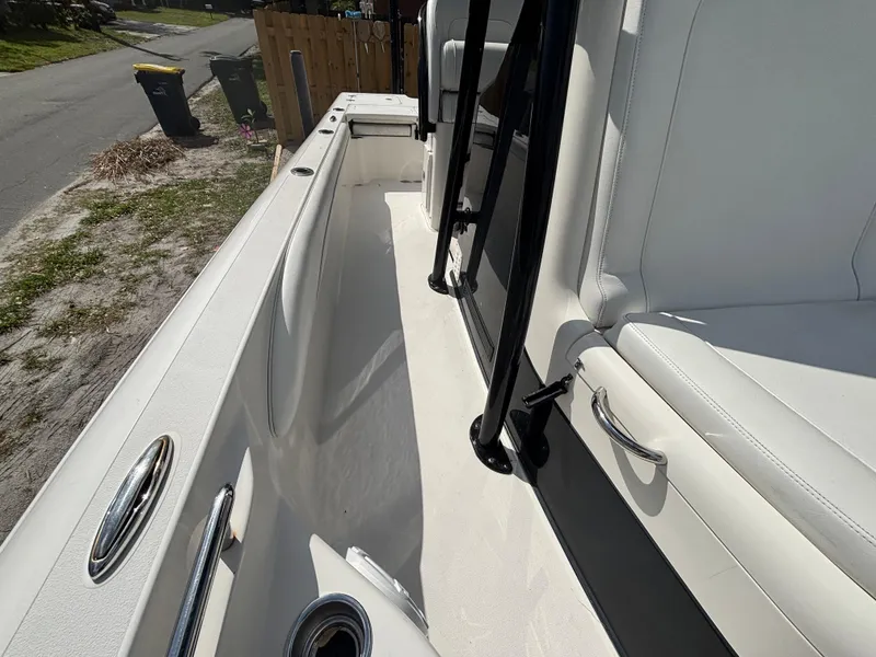 Slide: The Image of 2016 ShearWater 260 Carolina Bay boat interior with white seating and sleek design. - 25