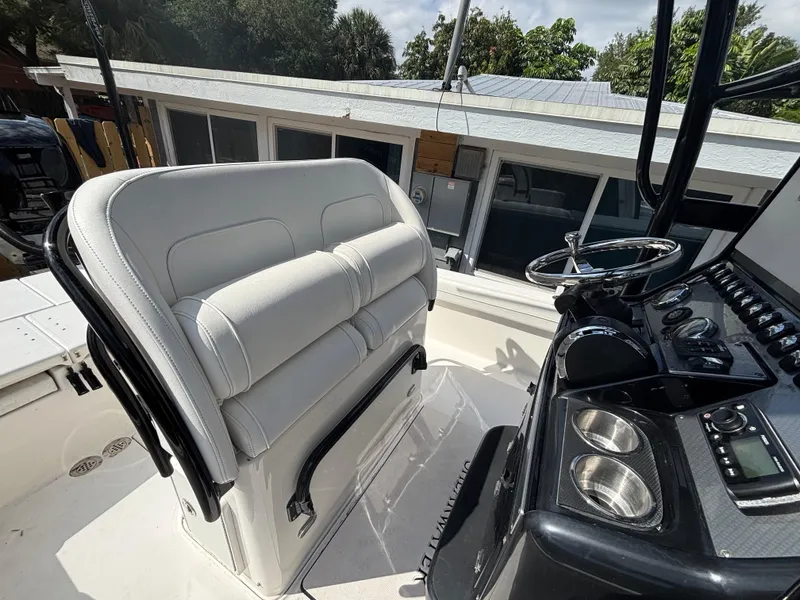 Slide: The Image of 2016 ShearWater 260 Carolina Bay boat interior with helm and seating. - 26