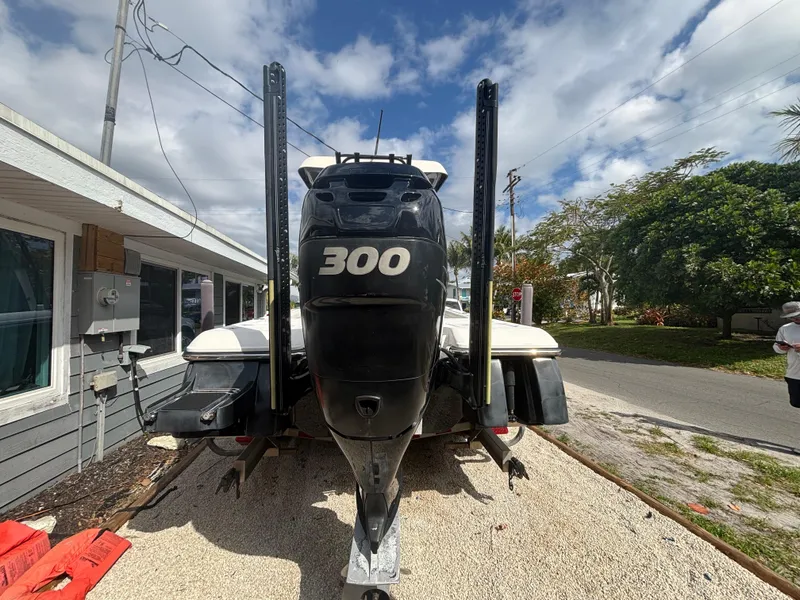 Slide: The Image of 2016 ShearWater 260 Carolina Bay boat with 300 horsepower engine, parked outdoors. - 6