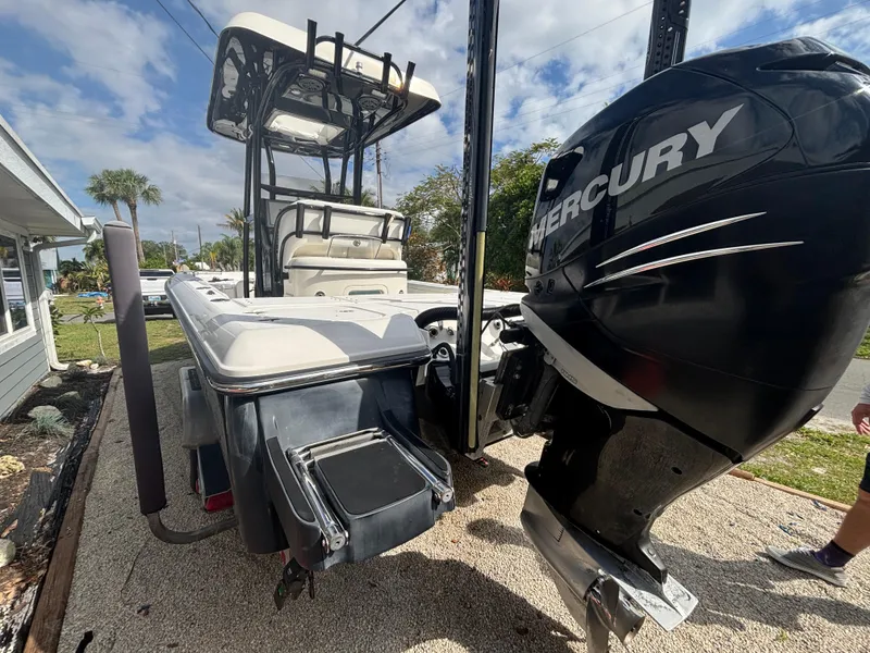 Slide: The Image of 2016 ShearWater 260 Carolina Bay boat with Mercury engine, docked outdoors. - 8
