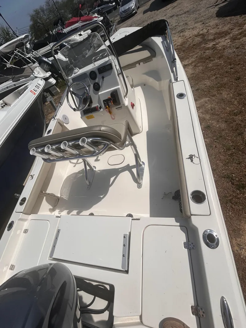 Slide: The Image of 2022 Key West 179FS boat, spacious deck, center console, and seating, ideal for fishing and leisure. - 2