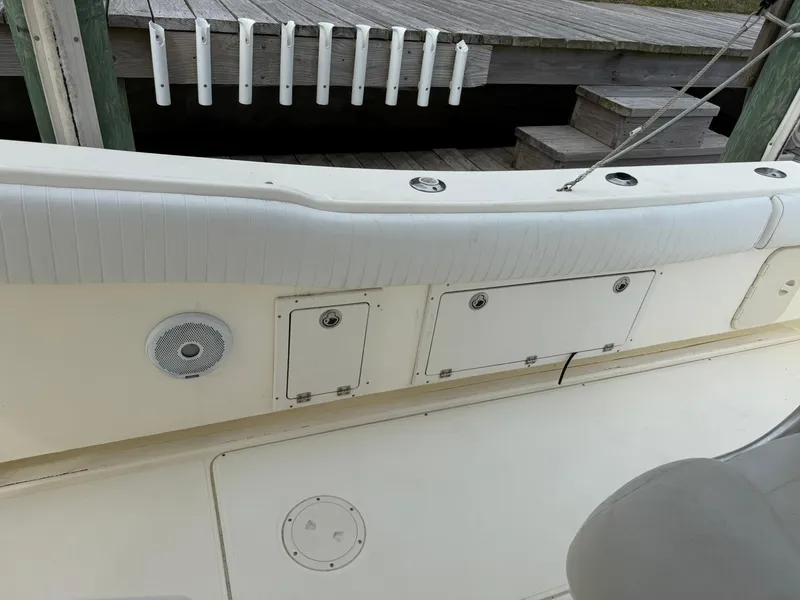 Slide: The Image of 2003 World Cat 330 TE boat interior with storage compartments and speaker. - 21