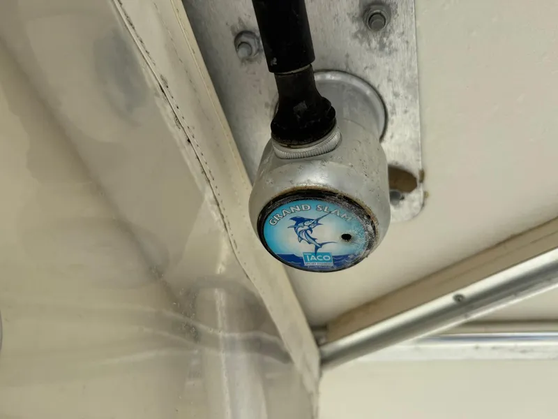 Slide: The Image of Close-up of a Grand Slam Taco marine fitting on a 2003 World Cat 330 TE boat. - 22