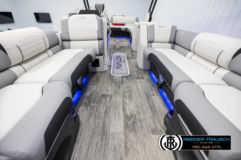 Slide: The Image of Luxurious interior of 2025 Avalon Excalibur LTD CRB pontoon boat with plush seating and ambient lighting. - 13