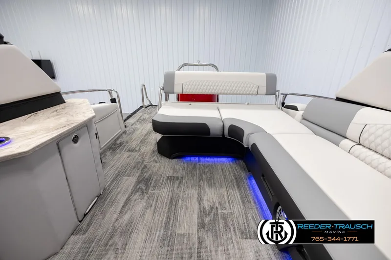 Slide: The Image of Luxurious interior of 2025 Avalon Excalibur LTD CRB pontoon with modern seating and ambient lighting. - 15