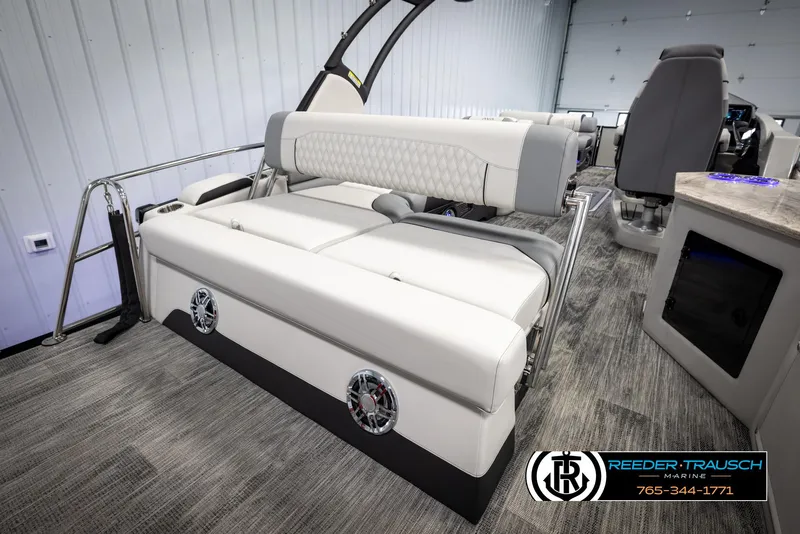 Slide: The Image of 2025 Avalon Excalibur LTD CRB boat interior with luxurious seating and modern design. - 25