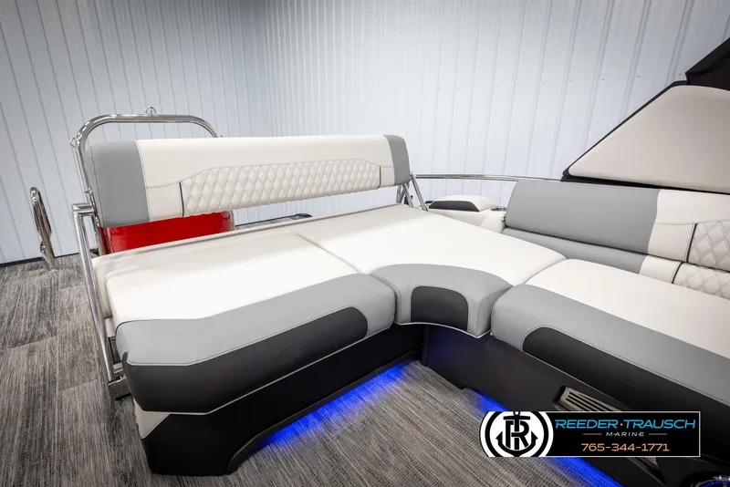 Slide: The Image of 2025 Avalon Excalibur LTD CRB interior with luxurious seating and ambient blue lighting. - 26