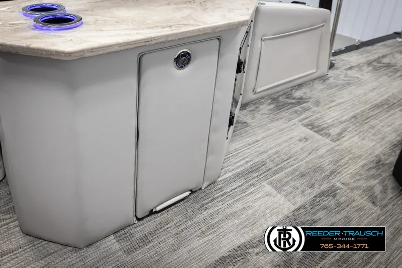 Slide: The Image of ```plaintext
2025 Avalon Excalibur LTD CRB interior with cup holders and storage compartment.
``` - 28