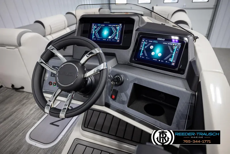 Slide: The Image of 2025 Avalon Excalibur LTD CRB boat dashboard with dual digital displays and steering wheel. - 30