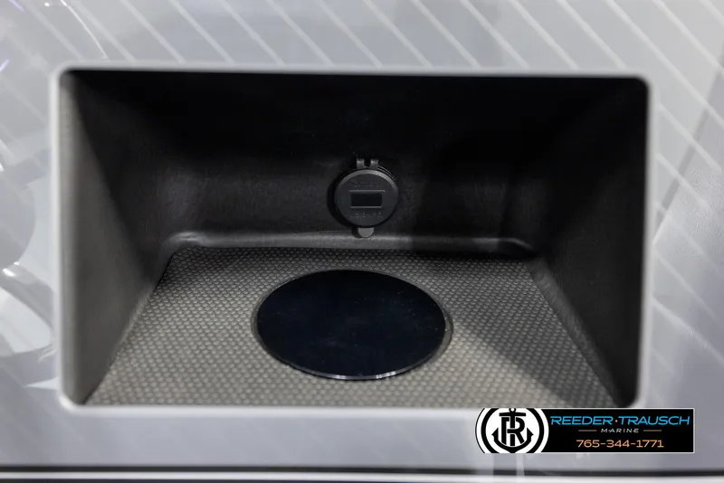 Slide: The Image of Interior compartment of 2025 Avalon Excalibur LTD CRB with USB port and textured surface. - 36