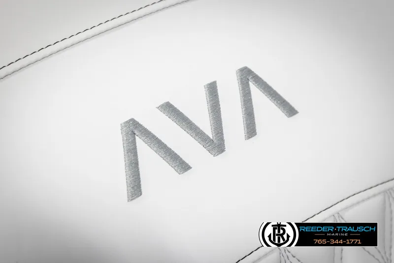 Slide: The Image of Close-up of Avalon Excalibur LTD CRB 2025 logo on white leather upholstery. - 39