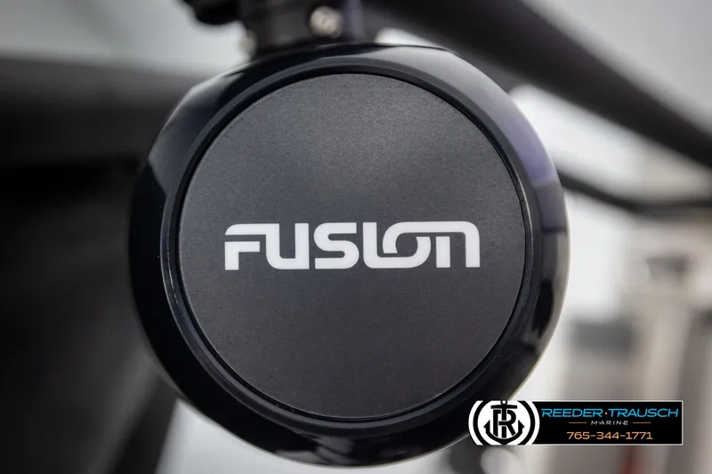 Slide: The Image of Close-up of Fusion speaker on 2025 Avalon Excalibur LTD CRB, Reeder-Trausch Marine branding visible. - 45