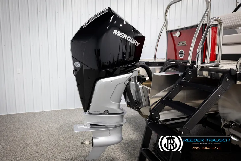 Slide: The Image of 2025 Avalon Excalibur LTD CRB with Mercury outboard motor in showroom. - 47
