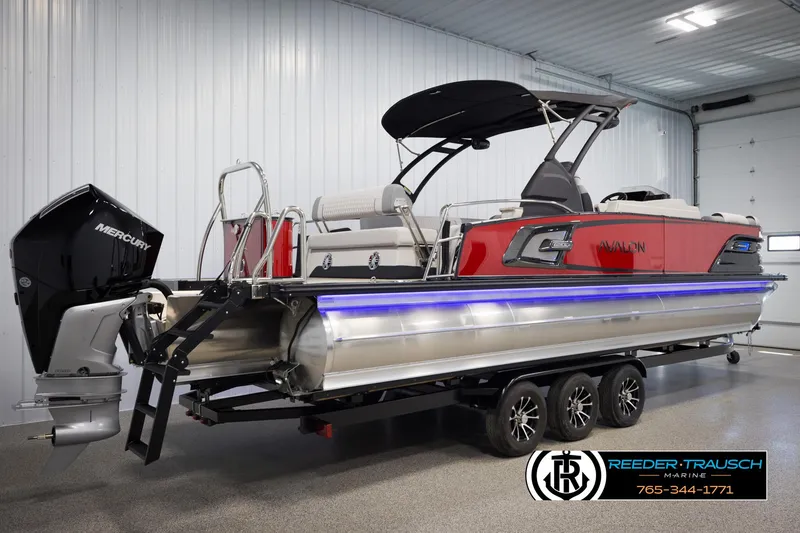 Slide: The Image of 2025 Avalon Excalibur LTD CRB pontoon boat with Mercury engine in a showroom. - 6