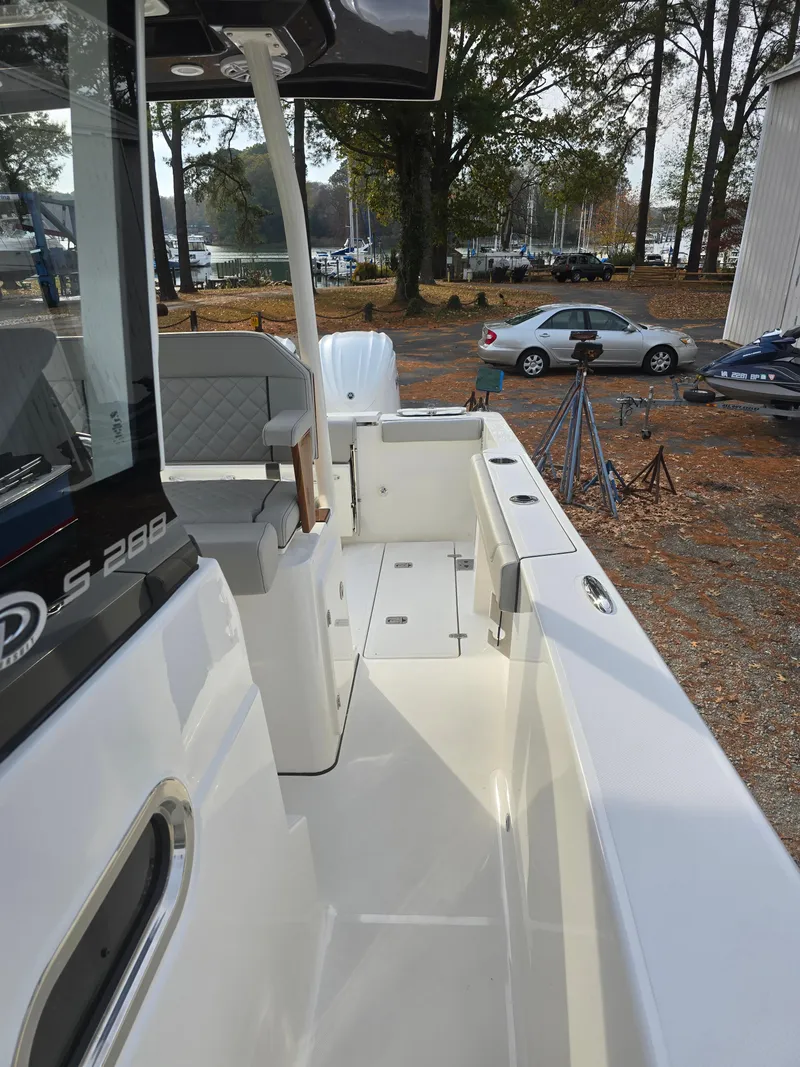 Slide: The Image of 2025 Pursuit S 288 boat deck, featuring sleek design and spacious seating area. - 19