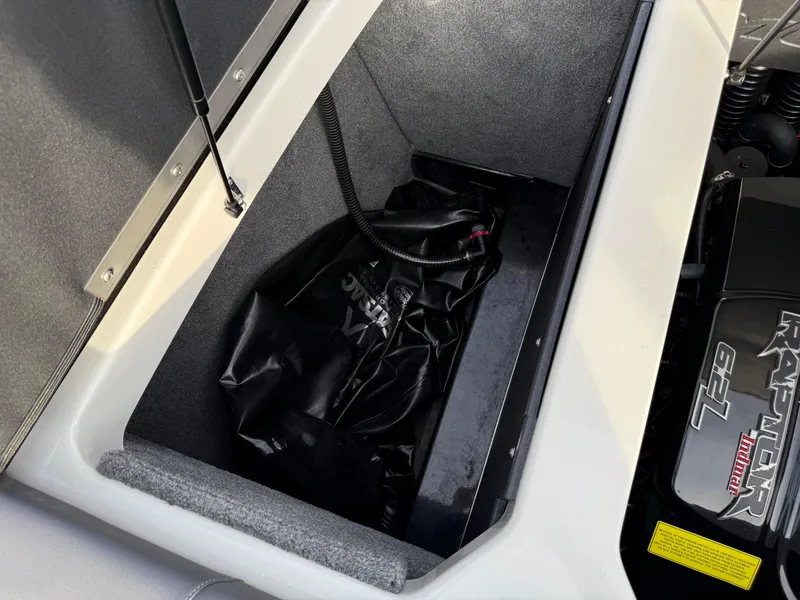 Slide: The Image of 2018 Moomba Helix storage compartment with ballast bag and engine components. - 31