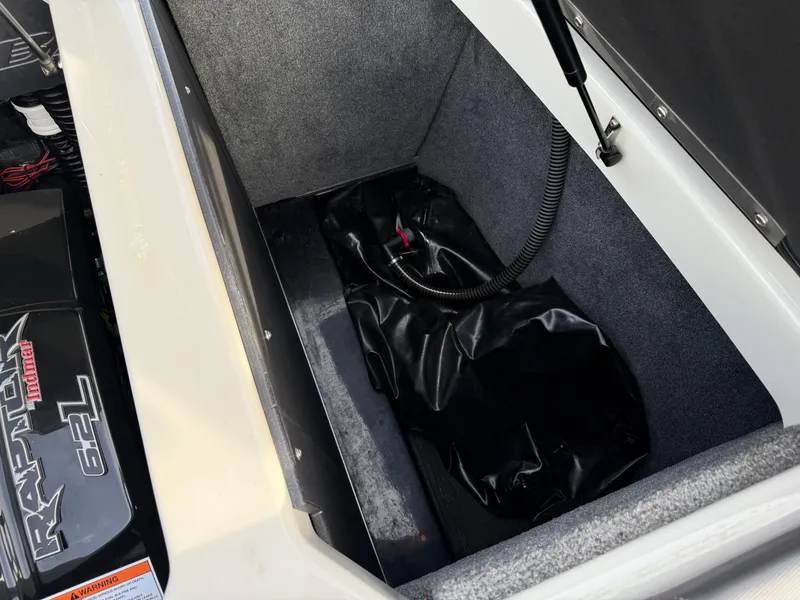 Slide: The Image of 2018 Moomba Helix storage compartment with ballast bag and hydraulic lift. - 33