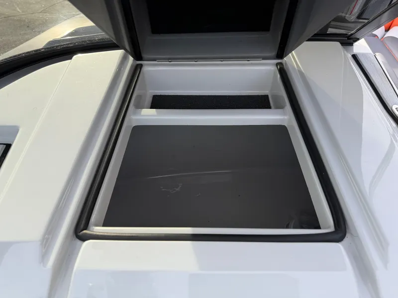 Slide: The Image of 2018 Moomba Helix storage compartment with open lid, showcasing interior space. - 41