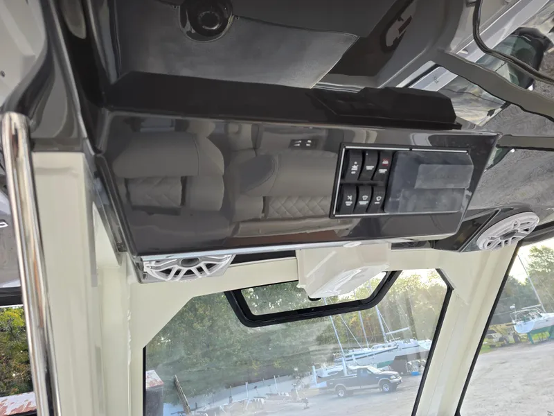 Slide: The Image of 2025 Pursuit S 328 boat interior with control panel and speakers. - 16
