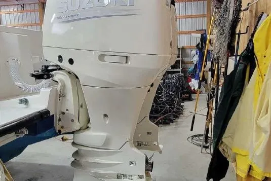 Slide: The Image of Suzuki outboard motor on a 2002 SeaVee Center Console boat. - 8