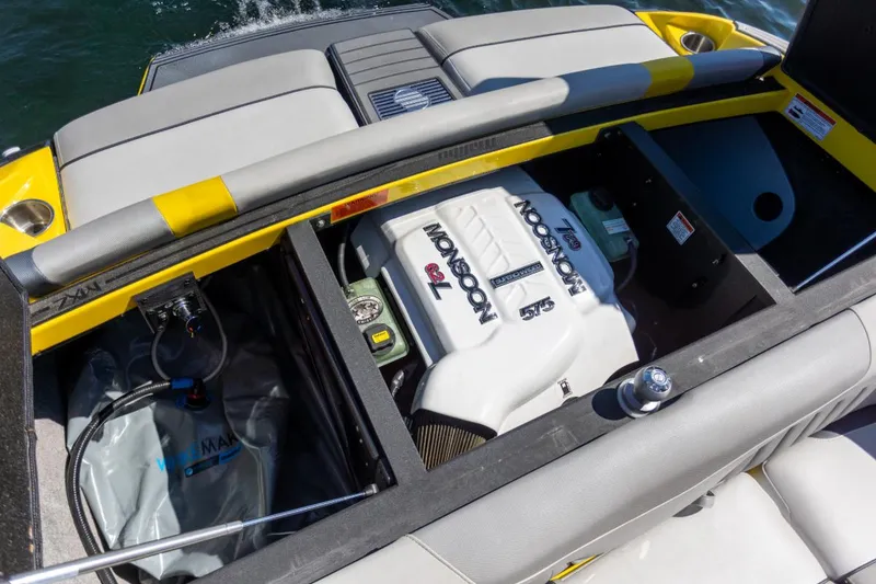 Slide: The Image of 2016 Malibu 24.5 MKZ boat engine compartment with Monsoon 575 engine. - 28