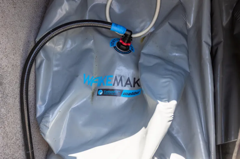 Slide: The Image of Ballast bag with hoses in a 2016 Malibu 24.5 MKZ boat. - 31