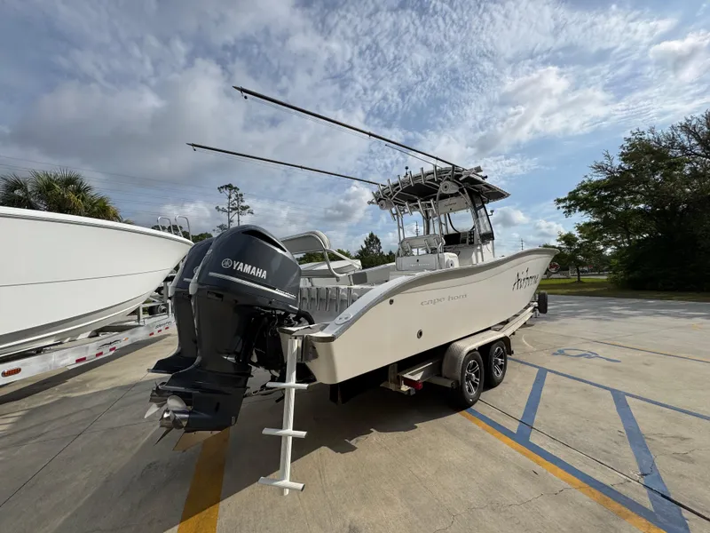 Slide: The Image of 2006 Cape Horn 31 T boat with Yamaha engine on trailer, parked outdoors. - 12