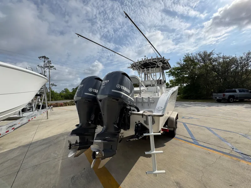 Slide: The Image of 2006 Cape Horn 31 T boat with dual Yamaha engines in a parking lot. - 13