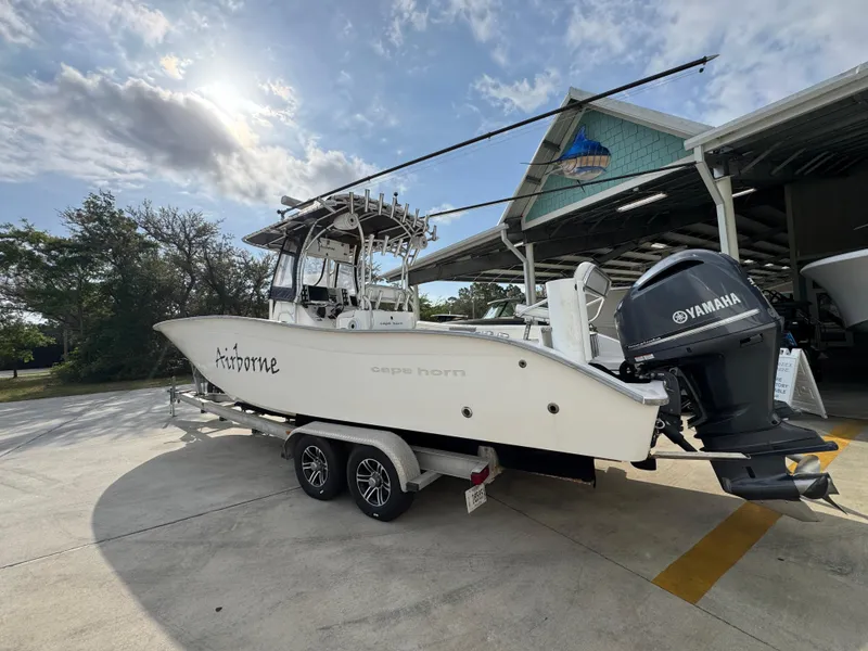 Slide: The Image of 2006 Cape Horn 31 T boat with Yamaha engine on trailer, parked outdoors. - 18