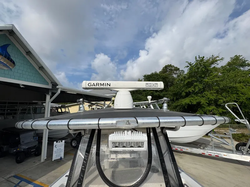 Slide: The Image of Cape Horn 31 T boat with Garmin radar, parked outdoors, under a partly cloudy sky. - 23