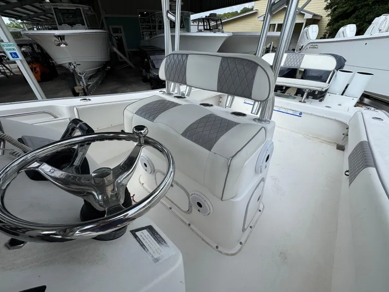 Slide: The Image of 2006 Cape Horn 31 T boat interior with steering wheel and cushioned seating. - 25