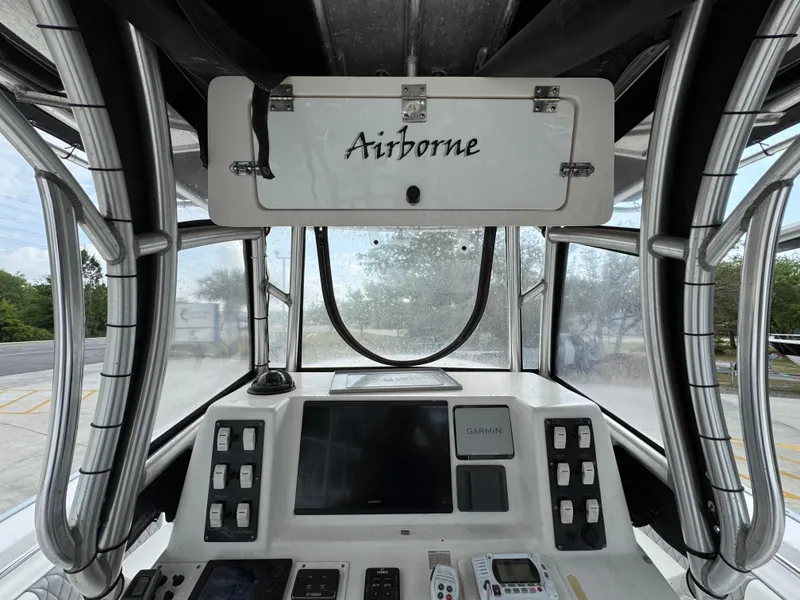 Slide: The Image of 2006 Cape Horn 31 T boat console with "Airborne" storage, featuring navigation controls and electronics. - 29