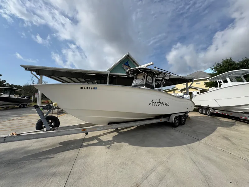 Slide: The Image of 2006 Cape Horn 31 T boat on trailer under cloudy sky. - 3