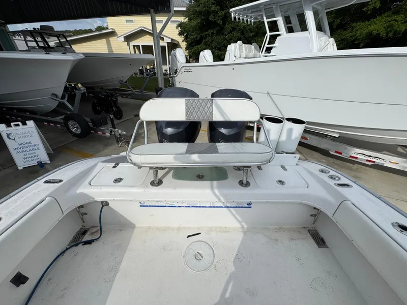 Slide: The Image of 2006 Cape Horn 31 T boat interior with seating and twin engines in a marina setting. - 34