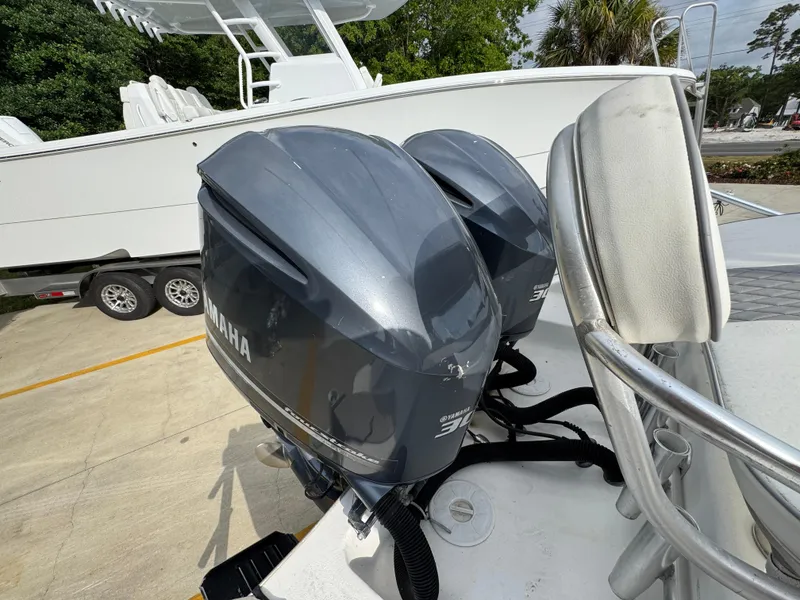 Slide: The Image of Twin Yamaha outboard engines on a 2006 Cape Horn 31 T boat, parked on a trailer. - 37