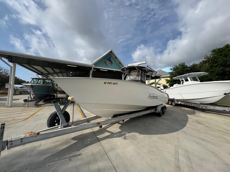 Slide: The Image of 2006 Cape Horn 31 T boat on trailer, parked outdoors under cloudy sky. - 4