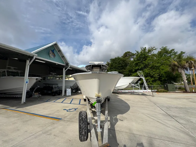 Slide: The Image of 2006 Cape Horn 31 T boat on trailer in marina parking lot under cloudy sky. - 6