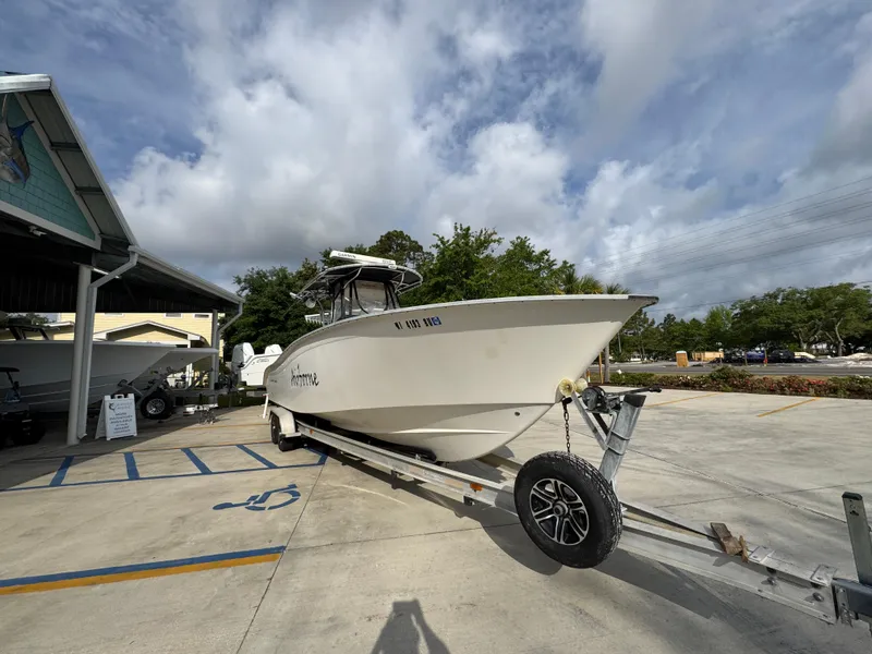 Slide: The Image of 2006 Cape Horn 31 T boat on trailer, parked outdoors under cloudy sky. - 7