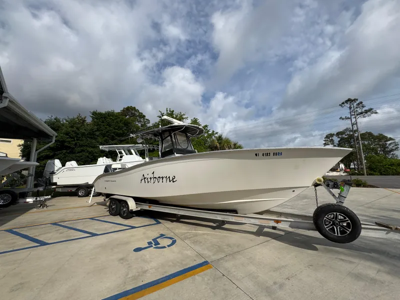 Slide: The Image of 2006 Cape Horn 31 T boat on trailer in parking lot under cloudy sky. - 8