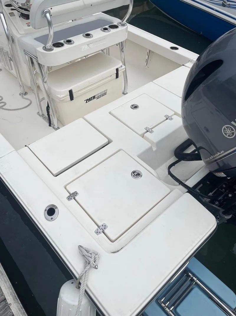 Slide: The Image of 2023 Pathfinder 2200 TRS boat with Yamaha engine, featuring spacious deck and storage compartments. - 3