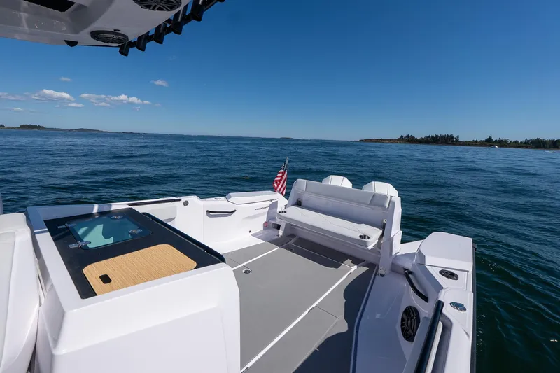 Slide: The Image of 2025 Axopar CCX Center Console boat with open storage compartment. - 13