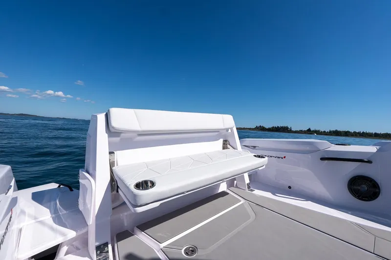 Slide: The Image of 2025 Axopar CCX Center Console boat on open water, featuring sleek design and spacious deck. - 14