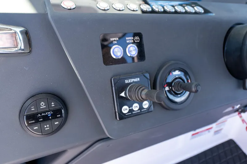 Slide: The Image of 2025 Axopar CCX Center Console dashboard with control buttons and navigation screens. - 25